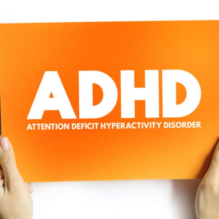 ADHD - Attention Deficit Hyperactivity Disorder acronym on card, medical concept background