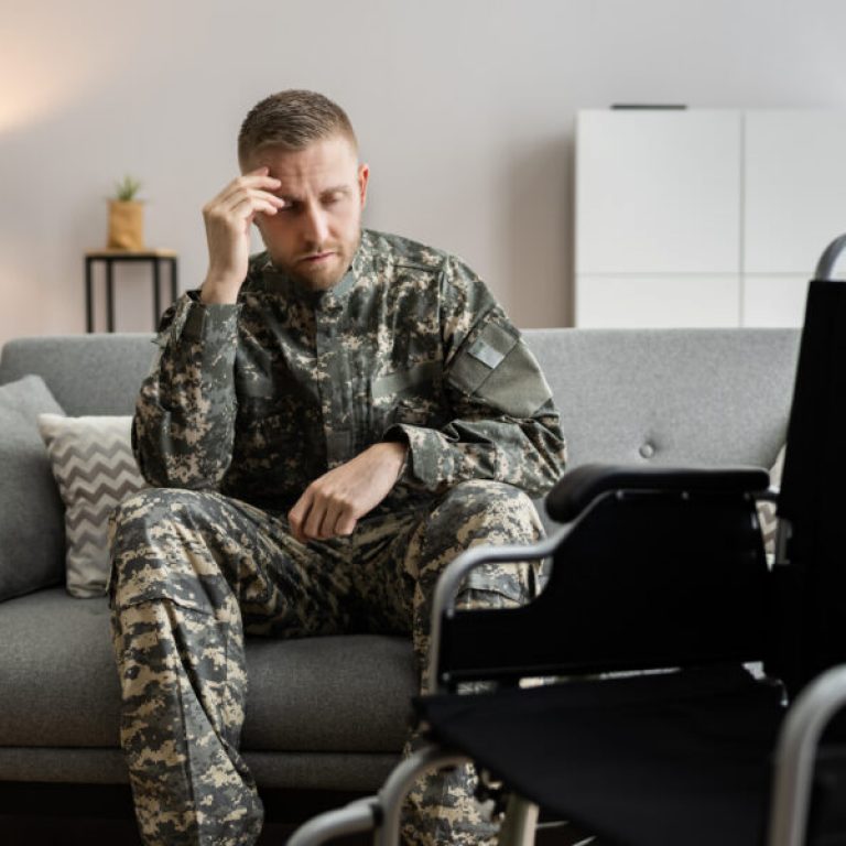 Disabled Military Soldier In Wheelchair With PTSD After Injury And Trauma