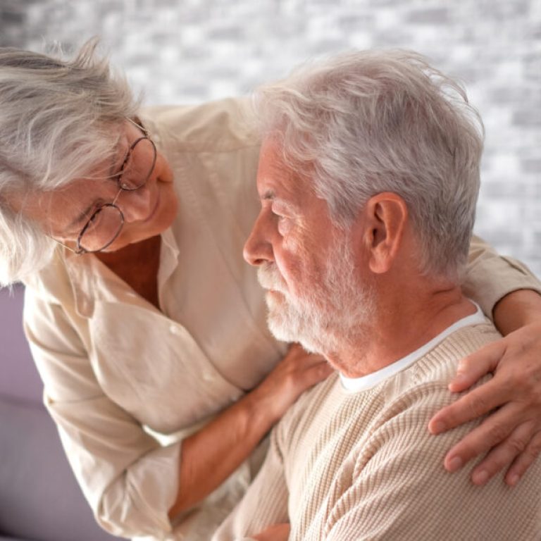 Old worried senior woman comforting her depressed, mental ill husband, unhappy elderly man at home need medical help. Ourmindsmatter