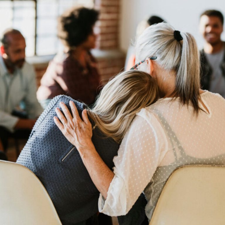 People support each other in a rehab session