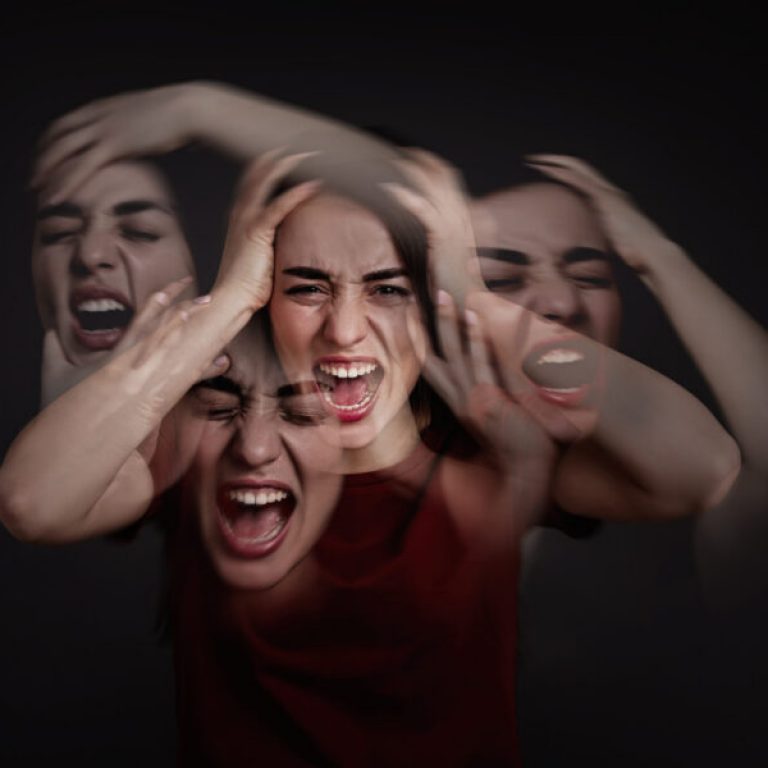 Woman with personality disorder on dark background, multiple exposure